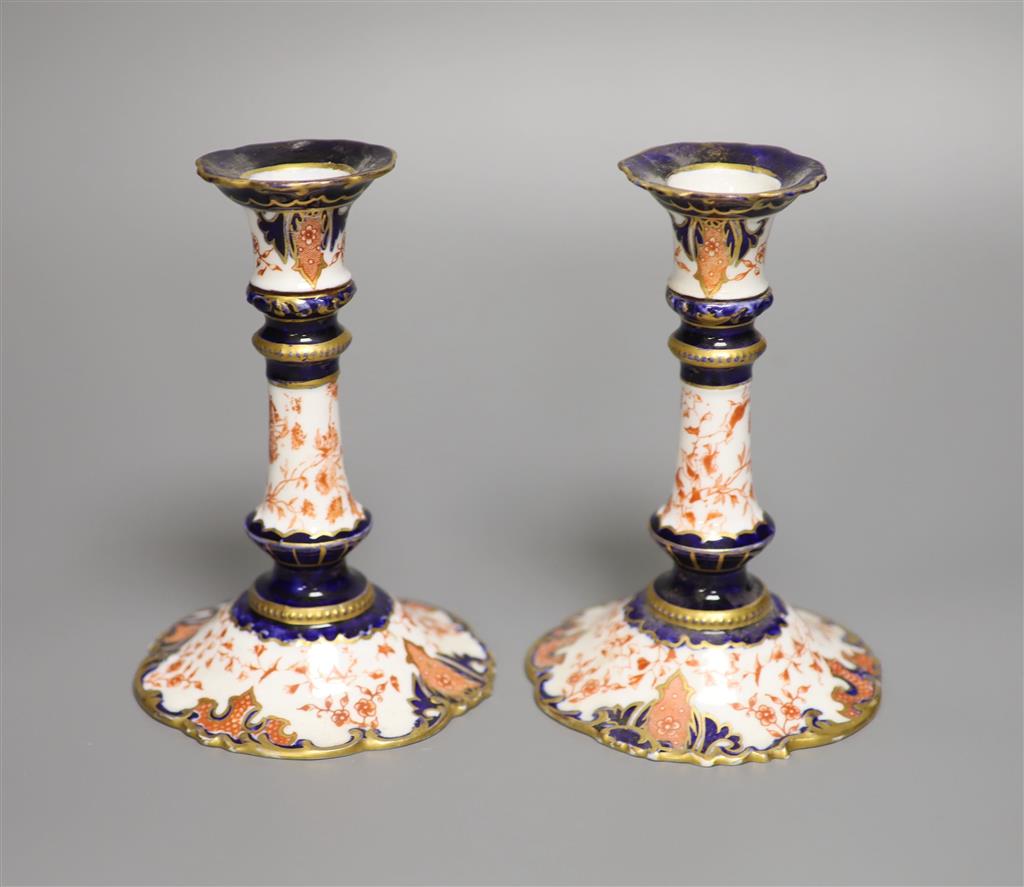 A pair of Royal Crown Derby candlesticks, height 15cm